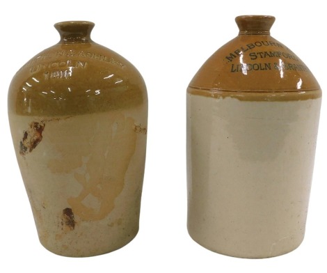 Two stoneware bottles for Whitton & Ashley of Lincoln, and Melbourn Brothers of Stamford, Lincoln & Grantham.