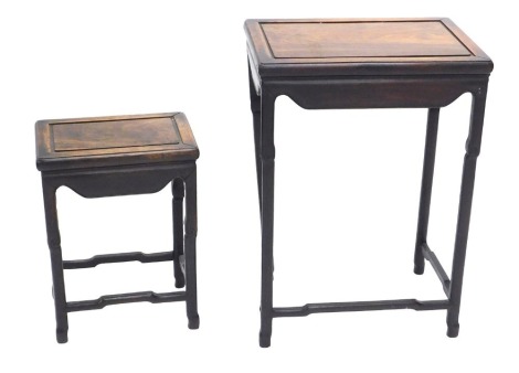 A part nest of two Chinese occasional tables, each with a rectangular top, on shaped legs, the largest 61cm high, 43cm wide, the smallest 42cm high, 31cm wide.