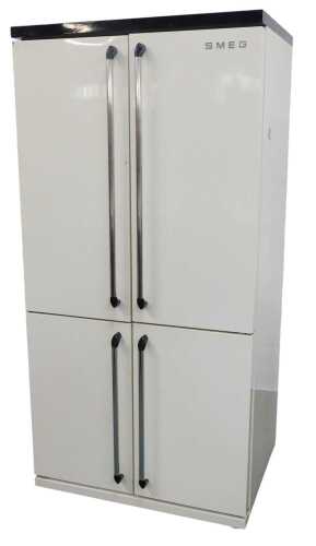 A Smeg four door fridge freezer, in cream, FQ960p, 186cm high, 92cm wide, 69cm deep.