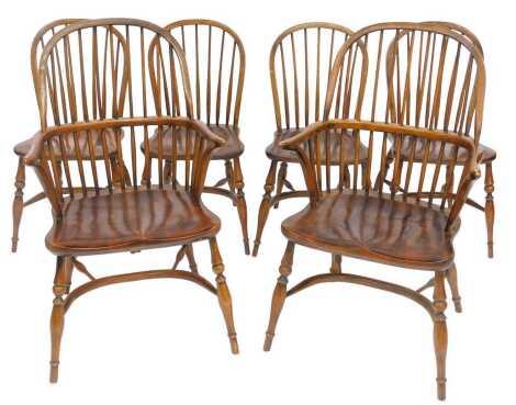 A set of six 19thC style elm country-made chairs, each with a spindle back, solid seat, on turned legs with crinoline stretcher, including two stretchers, each bearing label for Brights of Nettlebed.