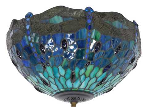 A Tiffany style uplighter shade, decorated with a repeat dragonfly design in blues and greens, 43cm diameter, with pendant fitment.