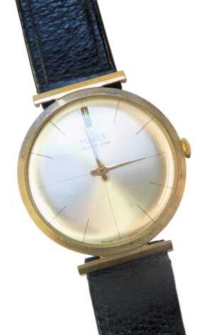 A Majex Slim Deluxe 9ct gold cased gent's wristwatch, with silvered batoned dial, with twenty one jewel movement, 3cm diameter, on a black leather strap, 26.6g all in, boxed.