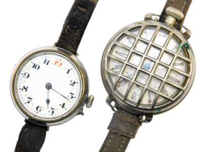 Two wristwatches, comprising a white metal cased wristwatch head, with white enamelled numeric dial and gold batoned border with blue hands, 3cm diameter, on a brown leather strap, and a further silver plated example. (2)