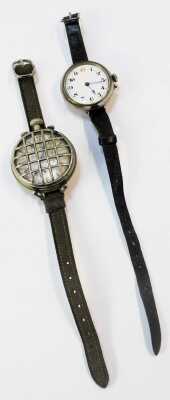 Two wristwatches, comprising a white metal cased wristwatch head, with white enamelled numeric dial and gold batoned border with blue hands, 3cm diameter, on a brown leather strap, and a further silver plated example. (2) - 4