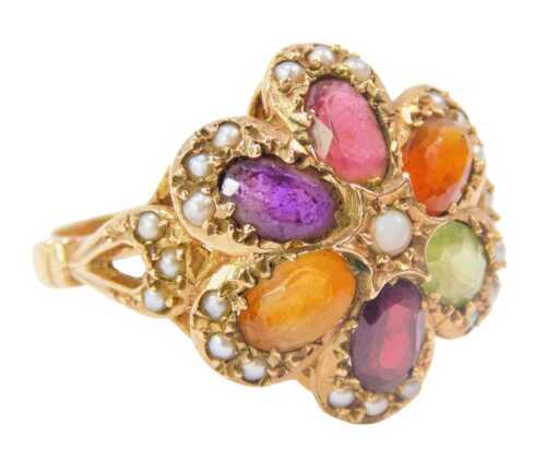 A 9ct gold floral cluster ring, the cluster set with semi precious stones, to include amethyst, citrine, topaz, peridot, ruby and seed pearl, the floral top, on loop moulded shoulders, on a raised ring head, ring size R½, 5.5g all in, boxed.