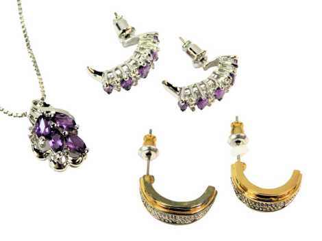 Three items of jewellery, comprising a pair of amethyst set hoop earrings, in nickel free base metal, and an associated necklace, and a pair of white stone set hoop earrings.