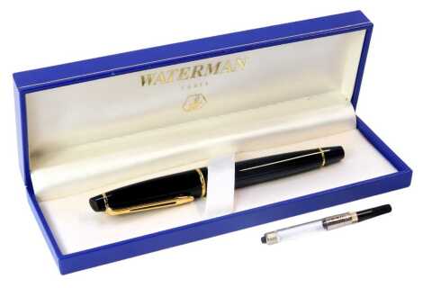 A Waterman's of Paris fountain pen, in black casing with gilt borders, stamped The W, boxed.