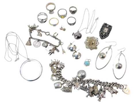 Assorted silver and other jewellery, comprising silver charm bracelets, paste stone set watch clip, filigree floral brooch, various dress rings, etc. (a quantity)