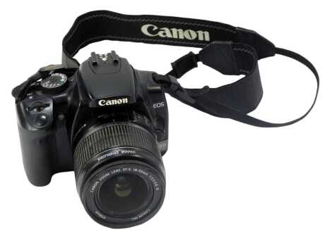 A Canon EOS digital camera, with Canon Zoom lens ef-s 18-55mm, and Canon charger and battery.