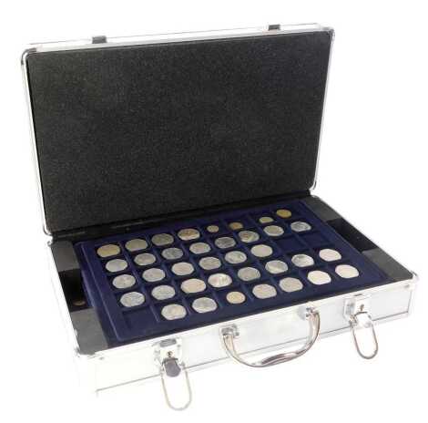 An aluminium coin case and collection of coins, to include fifty pence pieces, Sir Isaac Newton, Olympics and others, collector's crowns, threepence pieces, two shillings, football collector's coin medallions, etc. (1 case)