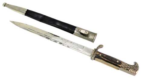 A Carl Blackthorn Solingen horn-handled dagger, with a bird moulded top, in a leather and steel scabbard, 42cm long.