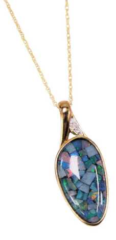 An imitation opal pendant and chain, the oval shaped opal fragment pendant set with three czs, in yellow metal frame stamped 9kt, on fine link neck chain stamped 375, the pendant 2.5cm high, the chain 46cm long, 2.2g all in, boxed.