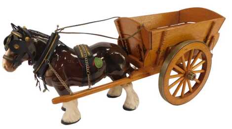 A Melba ware pottery model of a horse pulling a wooden cart, 30cm high.