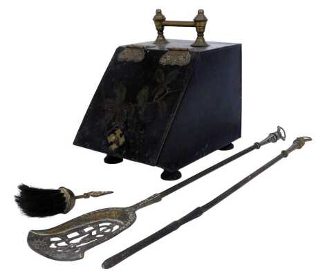 A Victorian black painted metal coal scuttle, the hinged lid decorated with a bird on branch, with brass handle and embossed brass hinges, 37cm high, together with a brass shovel and poker.