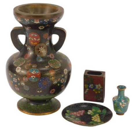 A Japanese cloisonne two handled vase, of baluster form, decorated with roundels containing butterflies and flowers, 20cm high, together with further miniature items of cloisonne comprising circular dish, miniature baluster vase and match case. (4)