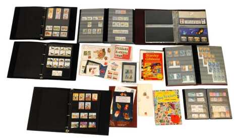 A Royal Mail presentation pack album, to include British Films, Games and Toys, Industrial Archaeology, Astronomy, Kew Gardens, together with various stamp albums containing GB Elizabeth II commemorative stamps, etc. (1 shelf)