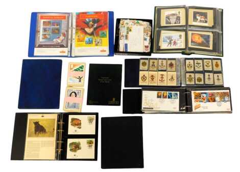 First day covers, silk cigarette cards, stamps, etc., to include an album containing silk cigarette cards depicting various infantry crests, de Reszke Homeland Series cards, used GB and world stamps, etc. (1 shelf)