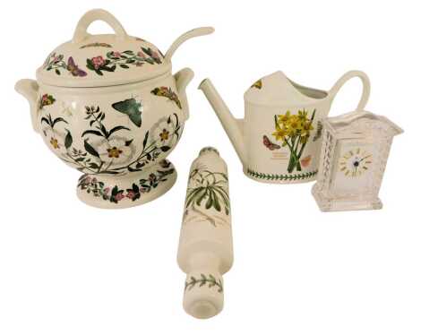 A Portmeirion Botanic Garden two-handled soup tureen and cover, 30cm high, with a label, together with a watering can, 20cm high, rolling pin, 35cm long, and a Royal Albert glass mantel clock with Roman numeric dial and quartz movement, 15cm high.