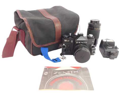 A Zenit 12XP camera, together with Helios 75x150mm lens, flash, contained in a canvas case.