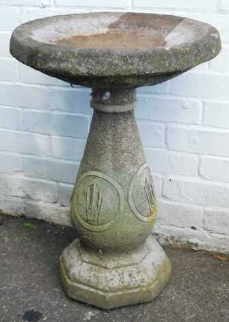 A reconstituted stone garden birdbath, on columned floral support, 68cm high, 47cm diameter.