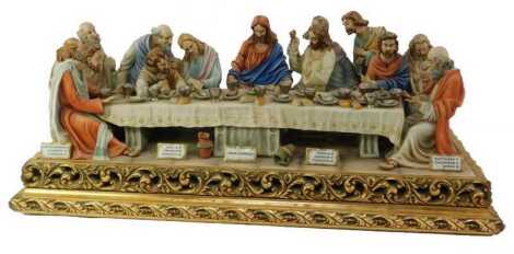 A Capodimonte porcelain figure group, The Last Supper by Jermano Cortese, on a giltwood plinth, signed, stamped and numbered 500, with certificate of authenticity, 34cm high, 83cm wide, 39cm deep. Upon initial inspection there is no damage or restoration 