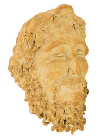 A composition stone carving, modelled as a bust of a gentleman with flowing hair and a beard, 30cm high.