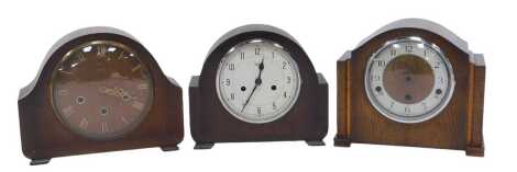 Three oak cased mantel clocks, comprising a Smiths eight day clock with Westminster chimes and Roman numeric dial, an Enfield with Westminster chime and Arabic numerals, and eight day movement (AF), and a Smiths Enfield eight day clock with Arabic numeral