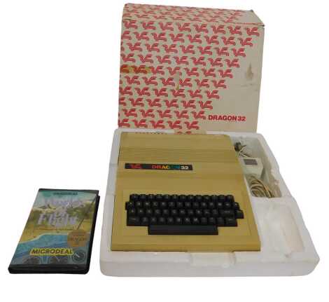 A Dragon 32 personal computer, together with a Worlds of Flight game.