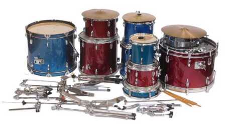 A ten piece drum kit, varying sizes, together with brass cymbals, stands, various drum sticks, etc.