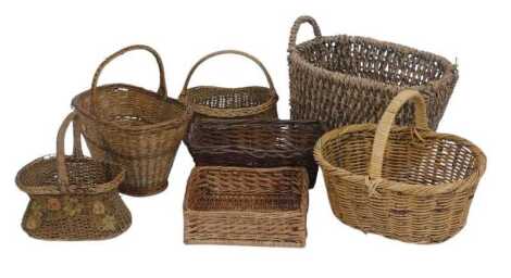 A group of wicker baskets, to include a flower basket with handle, 40cm high, etc. (a quantity)