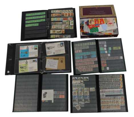 Philately. A collection of stamps and first day covers, comprising loose postally used stamps, first class stamp books, for occasions such as Christmas, stamp stock books, pennies, and others. (4 albums and 1 box)