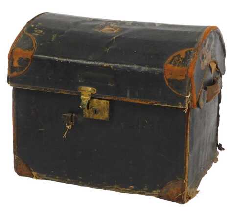 An early 20thC black leather domed chest, possibly Naval related, the top initialled LMW, with brown leather corners, enclosing a wicker lined interior, with two leather carrying handles, 50cm high, 60cm wide, 45cm deep.