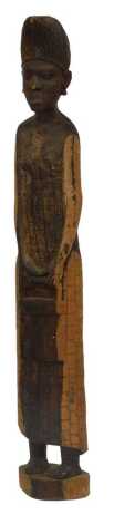 A carved hardwood tribal figure, depicting a female wearing a headdress, carrying a water bucket, 123cm high.