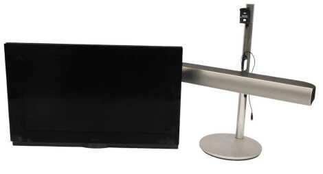 A Bang and Olufsen Beovision 7 40" television, serial number 19066192, on stand, with lead and remote.