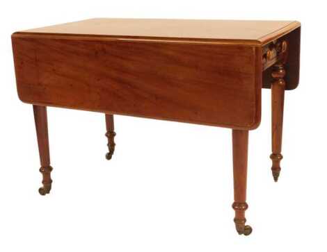 A Victorian mahogany drop leaf table, with frieze drawer, on turned legs with brass castors, 73cm high, 105cm wide, 60cm deep, 116cm extended.