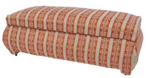 A 20thC upholstered footstool, in Regency stripe type fabric, in rust and off white, of rectangular form with domed top, 50cm high, 124cm wide, 58cm deep.