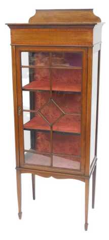 An Edwardian mahogany and line inlaid display cabinet, the top with a raised back above an astragal glazed door, with glazed side panels, on square tapering legs with spade feet, 155cm high, 60cm wide, 35cm deep.