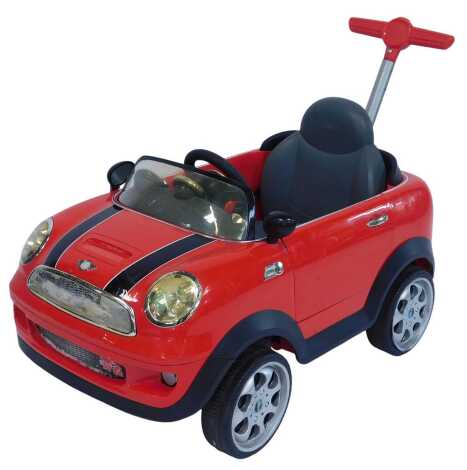 A Mini Cooper S child's push along car, in red, 73cm wide.