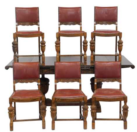 A 20thC oak draw leaf table, the rectangular top with carved frieze, on carved cup and cover supports united by a H shaped stretcher, on stepped feet, 80cm high, the top 124cm x 93cm, together with two leatherette and stud work dining chairs. The upholste