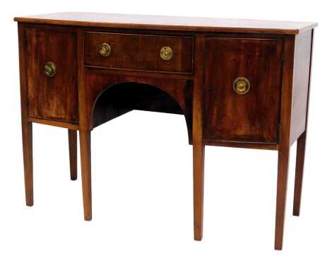 A 19thC mahogany bow front sideboard, with frieze drawer flanked by two cupboards, on square legs, 84cm high, 1120cm wide, 54cm deep.