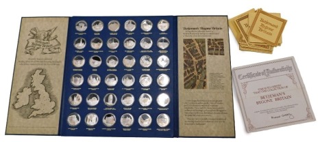 John Pinches Betjeman's Bygone Britain sterling silver proof medal set, comprising thirty-six silver medals in a fitted display case, limited edition of 1,266, with original certificates and contained in slip case.