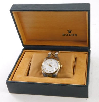 A gentleman's Rolex Oyster Perpetual Datejust wristwatch, model number 16013, with bi-metallic stainless steel and gilt case and bezel, white dial and Roman numerals, with bracelet strap, and original box, with original guarantee purchased 9th July 1988, - 7