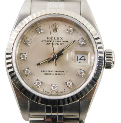 A ladies Rolex Oyster Perpetual Datejust wristwatch, model number 69174, circa 1988, with stainless steel case, and bracelet strap, having diamond markers to the silvered dial, with original green leather case and some paperwork.