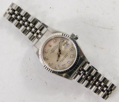 A ladies Rolex Oyster Perpetual Datejust wristwatch, model number 69174, circa 1988, with stainless steel case, and bracelet strap, having diamond markers to the silvered dial, with original green leather case and some paperwork. - 2