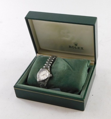 A ladies Rolex Oyster Perpetual Datejust wristwatch, model number 69174, circa 1988, with stainless steel case, and bracelet strap, having diamond markers to the silvered dial, with original green leather case and some paperwork. - 7