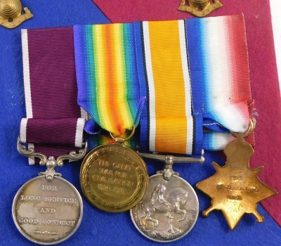 A WWI Royal Artillery medal group, comprising 1914 star, with 'Mons' clasp, 1914/18 British War Medal, Victory Medal, with oak leaf insignia (mentioned in dispatches) George V Long Service and Good Conduct Medal, inscribed to 6077 Bombardier E Seabrook, R - 3