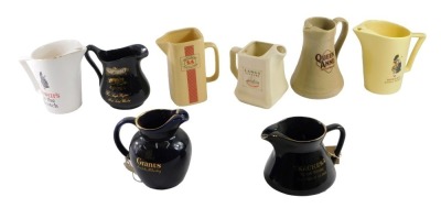 A group of Scotch whisky advertising water jugs, including Grants, Dewar's, Langs Supreme, etc. (8)