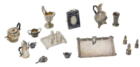 A collection of Royal Tunbridge Wells Ltd silver doll's house miniatures, comprising a selection of classic antique style tea and coffee pots, etc., including Paul Storr design tea tray, condiment pieces, Garrard style ewer, Paul Storr teapot, Queen Anne 