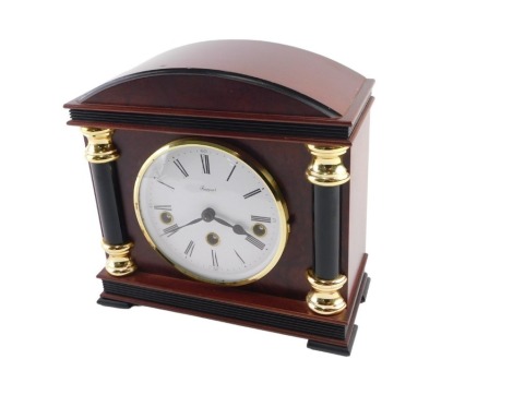 A Rapport mahogany architectural cased mantel clock, with Franz Hermle chiming movement, with white dial and Roman numerals, 23cm high.