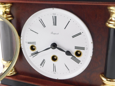 A Rapport mahogany architectural cased mantel clock, with Franz Hermle chiming movement, with white dial and Roman numerals, 23cm high. - 2